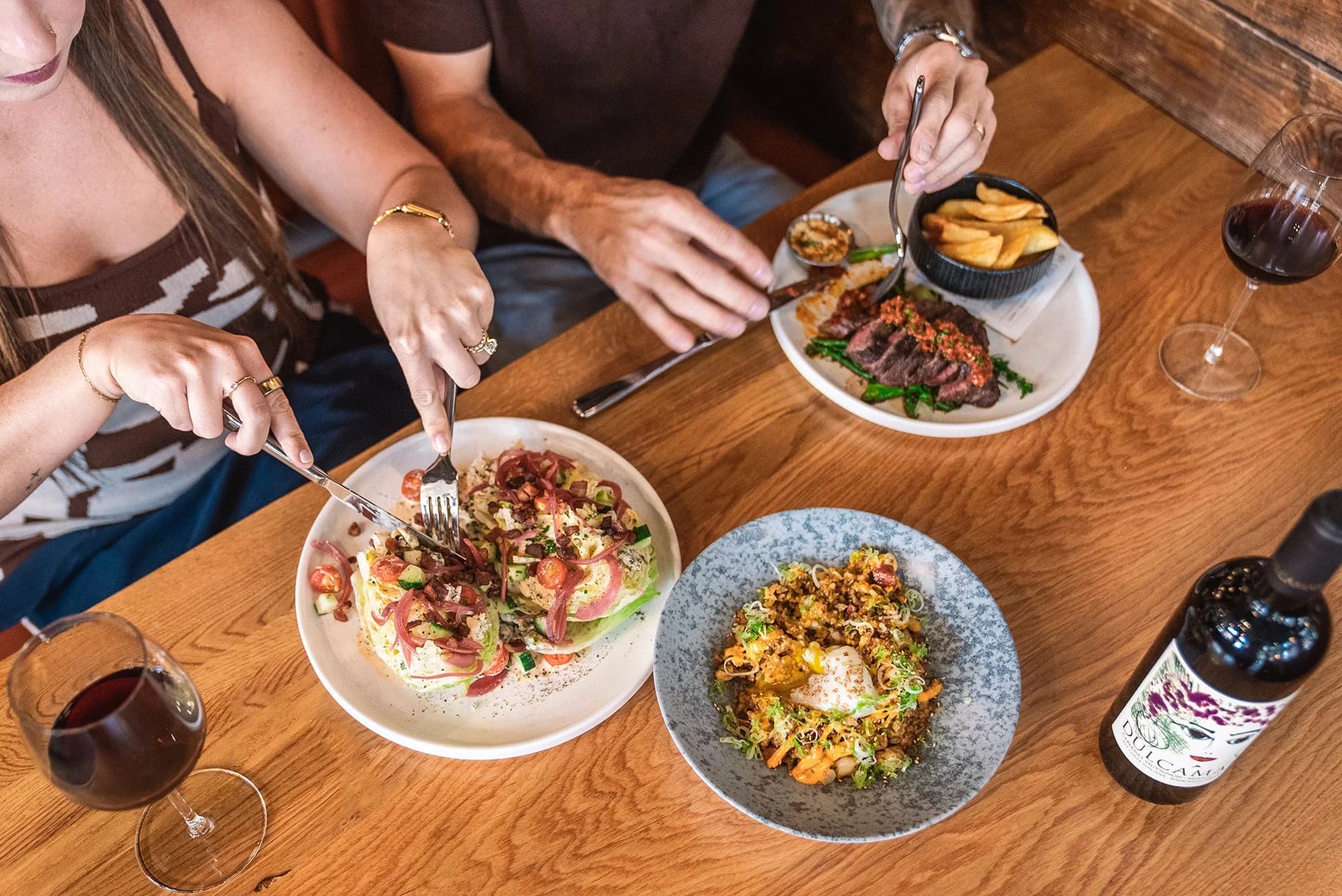 Guests dining around a table at Plank Provisions